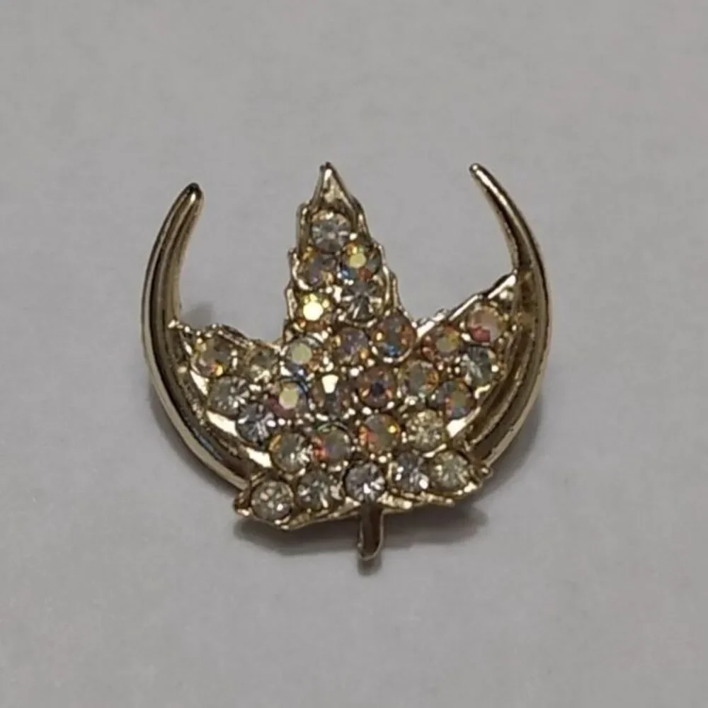 Gold tone rhinestone leaf brooch
